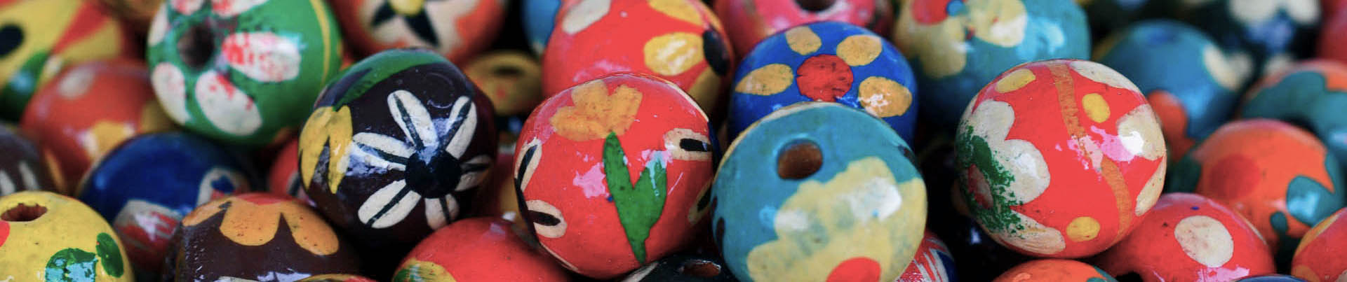 Close-up of various painted beads.