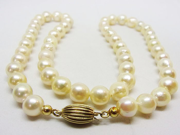 White pearly beaded necklace.